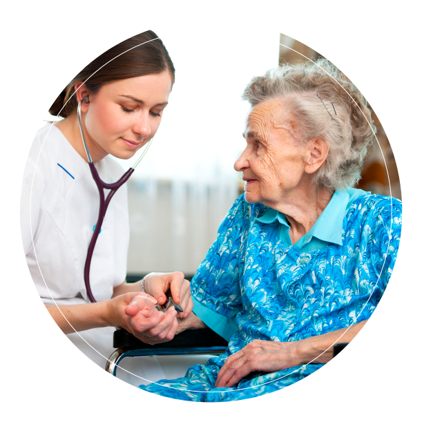 Caregiver taking blood pressure of old lady